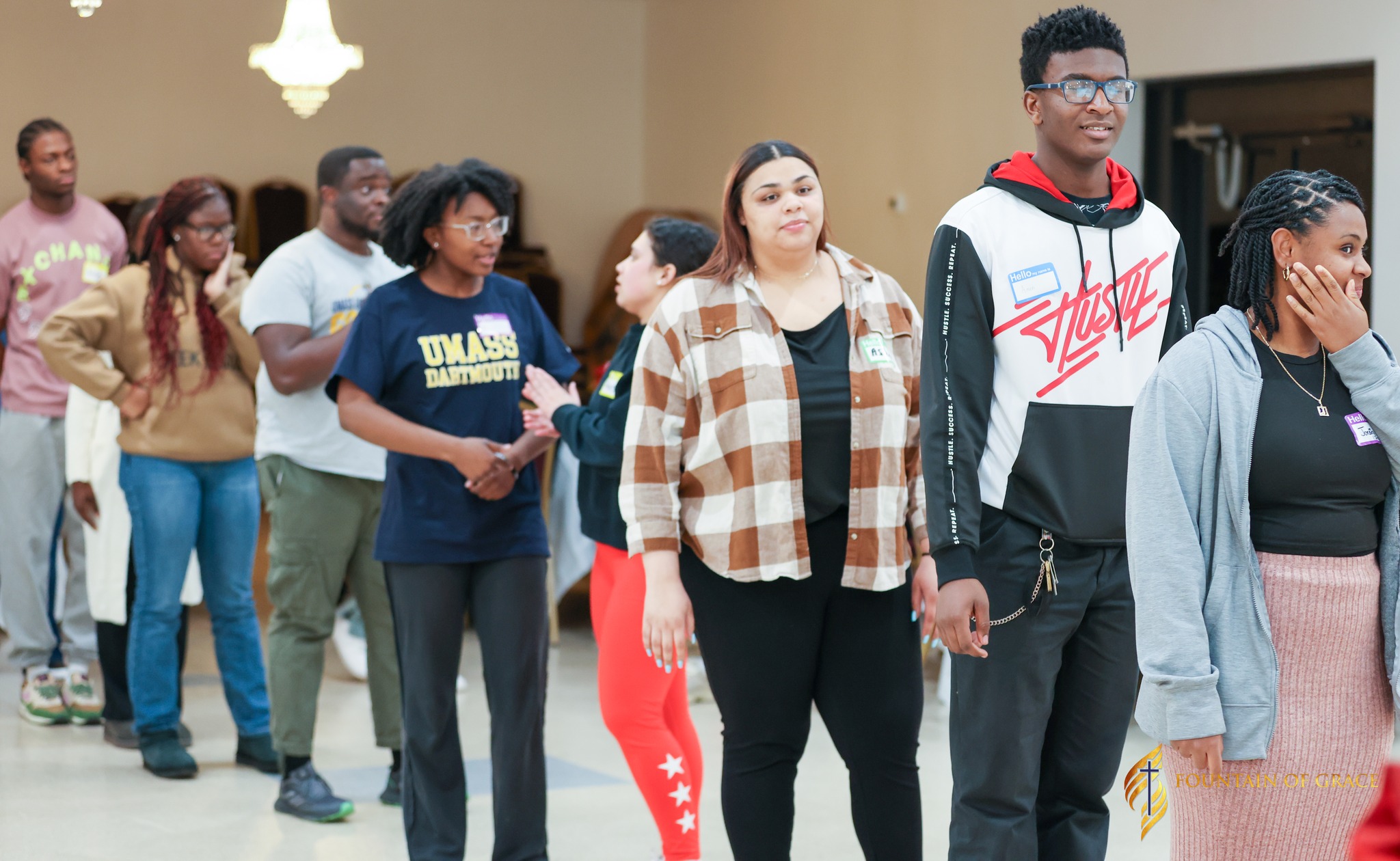 Group of young men standing together talking outside